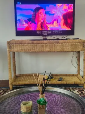 a flat screen tv sitting on top of a bench at The loft farmhouse in Roodeplaat area in Wallmannstal
