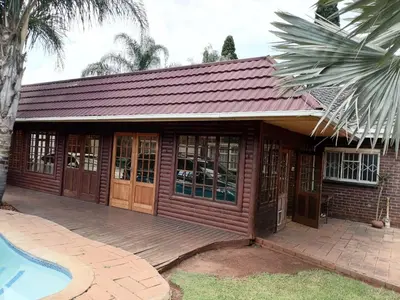 a house with a deck and a swimming pool at 4 Seasons Country Club in Vosburg