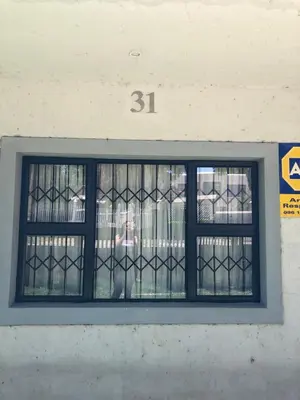 a window in a building with the number at Nyumbani in Kempton Park