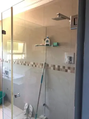 a shower with a glass door in a bathroom at Nyumbani in Kempton Park