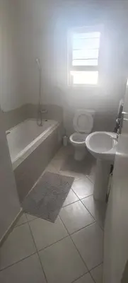a bathroom with a tub and a toilet and a sink at Lerato's Guesthouse 840 in Polokwane