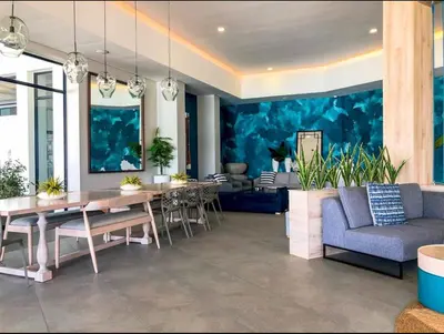 a living room with a table and a couch at Apartment at The Blyde in Pretoria