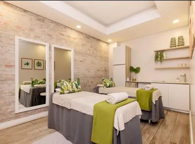 a hospital room with two beds and a mirror at The blyde crystal lagoon 116 in Pretoria