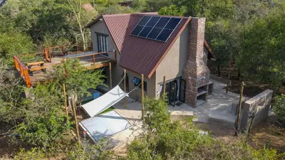 an overhead view of a house with a solar roof at Marloth Park, Self Catering Buffel st 4347 in Marloth Park