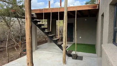 a house under construction with a staircase on it at Marloth Park, Self Catering Buffel st 4347 in Marloth Park