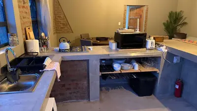 a kitchen with a sink and a counter top at Marloth Park, Self Catering Buffel st 4347 in Marloth Park