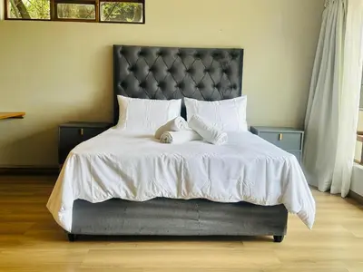 a bed with two stuffed animals sitting on it at 100 on Simon Bekker Kosmos in Hartbeespoort
