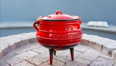 a red fire hydrant sitting on top of a sidewalk at La-Ngwenya Serenite in Warmbaths