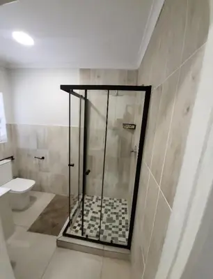 a shower in a bathroom with a toilet at Limewood 2 in Sandton