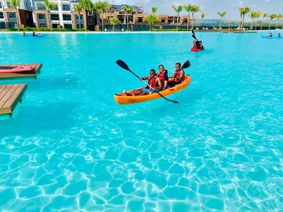 two people are in a kayak in the water at The Blyde Pretoria 2 bed 2 bath apartment in Pretoria
