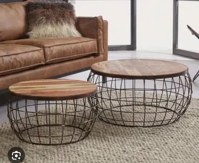 two nesting tables in a living room next to a couch at Trilogy Luxurious Resorts in Pretoria