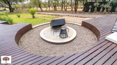 a chair sitting in a circle on a patio at Zebula Golf and Wildlife Estate - Tuskers Retreat Pax 20 in Warmbaths