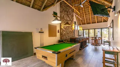 a room with a pool table and a chalkboard at Zebula Golf and Wildlife Estate - Tuskers Retreat Pax 20 in Warmbaths