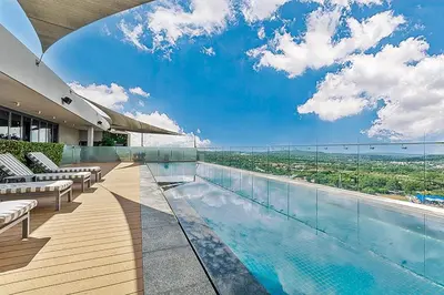 a swimming pool on a building with a view at Capital Residence Apartment in Menlyn Maine in Pretoria