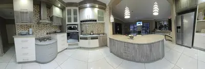 a large kitchen with a large island in the middle at Batuka Damview Lodge in Tshakhuma
