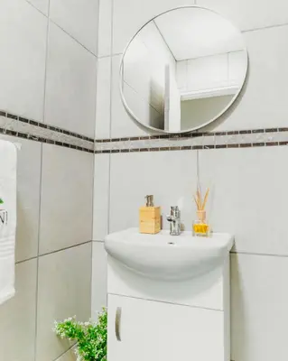 a bathroom with a sink and a mirror at Lavani Lodge in Lerulaneng