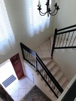 a staircase in a house with a stair case at Villa at Wekker in Pretoria