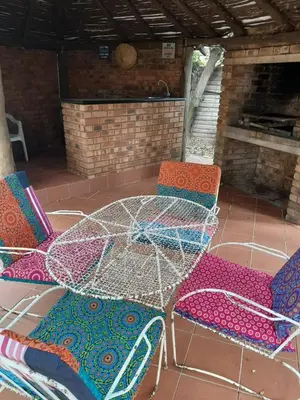 a table and chairs on a patio at Villa at Wekker in Pretoria