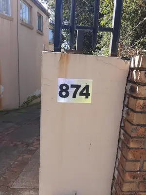 a sign on the side of a wall at Villa at Wekker in Pretoria