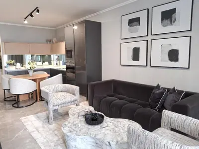 a living room with a couch and a table at Ellipse Kepler High-Rise 2-Bedroom en-suite Luxury Apartment in Midrand