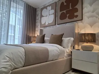 a bedroom with a large white bed and a window at Ellipse Kepler High-Rise 2-Bedroom en-suite Luxury Apartment in Midrand