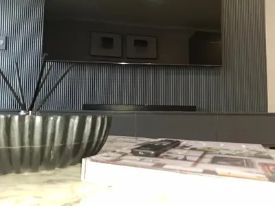 a silver bowl sitting on a table in a room at Ellipse Kepler High-Rise 2-Bedroom en-suite Luxury Apartment in Midrand