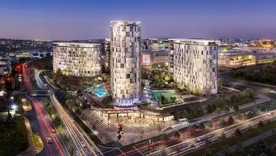 a city with two tall buildings and traffic at night at Ellipse Kepler High-Rise 2-Bedroom en-suite Luxury Apartment in Midrand