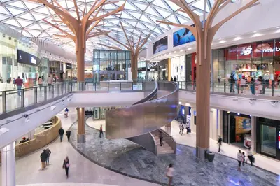 a shopping mall with people walking through it at Ellipse Kepler High-Rise 2-Bedroom en-suite Luxury Apartment in Midrand