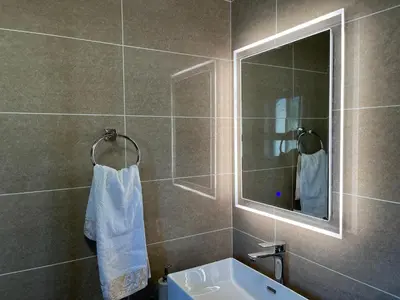 a bathroom with a sink and a mirror at Lake view Apartment and suite in Midrand