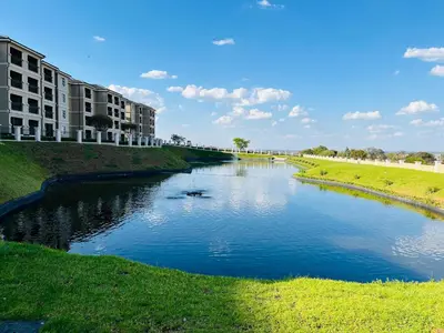 a river with two boats in the middle at Lake view Apartment and suite in Midrand
