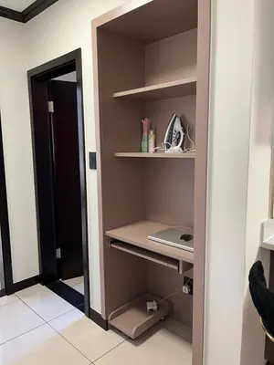 a room with a closet with a laptop on a shelf at Lake view Apartment and suite in Midrand