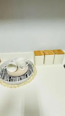 a shelf with a plate and cups on it at House of sebo in Pretoria