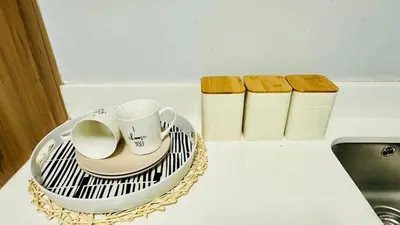 a tray with a coffee cup on a counter next to a sink at House of sebo in Pretoria