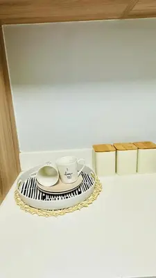 a tray with a coffee cup and a saucer at House of sebo in Pretoria
