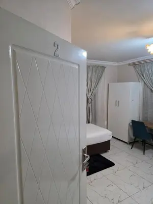 a room with a door leading to a bedroom with a bed at AB Lisi Accommodation in Pretoria