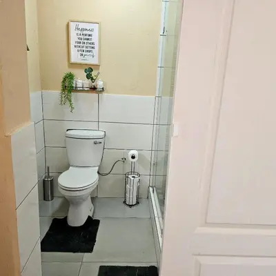 a bathroom with a toilet in a room at The Luxury stay in Midrand
