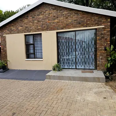 a brick building with a large window on it at The Luxury stay in Midrand