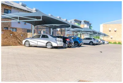 a group of cars parked in a parking lot at Time out Main in Pretoria