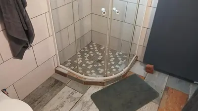 a shower with a glass door in a bathroom at 329 on 30th Avenue Villieria Jimmy in Pretoria