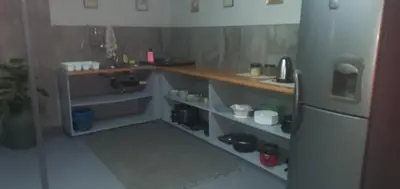 a kitchen with a counter and a sink and a refrigerator at 329 on 30th Avenue Villieria Jimmy in Pretoria