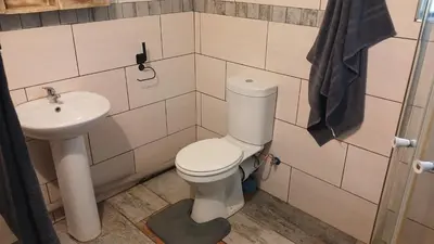 a bathroom with a toilet and a sink at 329 on 30th Avenue Villieria Jimmy in Pretoria