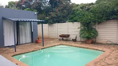 a small swimming pool in a yard with a fence at 329 on 30th Avenue Villieria Jimmy in Pretoria