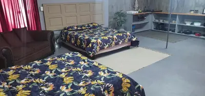 a bedroom with two beds and a couch at 329 on 30th Avenue Villieria Jimmy in Pretoria