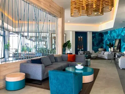 a living room with a couch and a table at A small haven - The blyde crystal lagoon in Pretoria