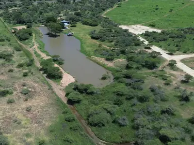 an aerial view of a riverurrency with a road at Nonaka in Louis Trichardt