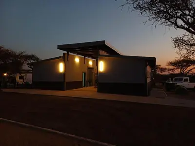 a small building with lights on the side of it at Nonaka in Louis Trichardt
