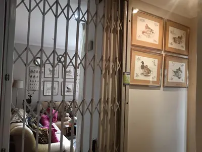 a room with a door with a iron gate at AAA Accommodation in Pretoria