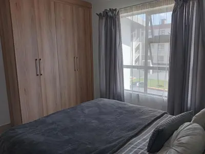 a bedroom with a bed and a large window at Irene Moo Stay in Pretoria