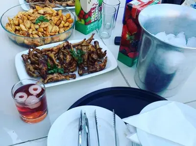 a table with two plates of food on it at Catwalk Lodge in Pretoria
