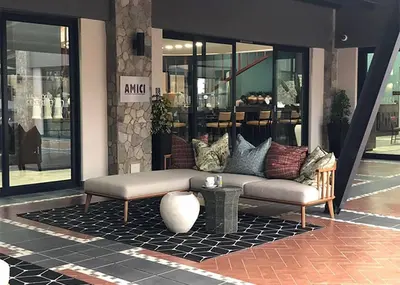 a couch sitting on a rug in front of a store at Comfy 2-Bedroom at Kikuyu Estate in Johannesburg